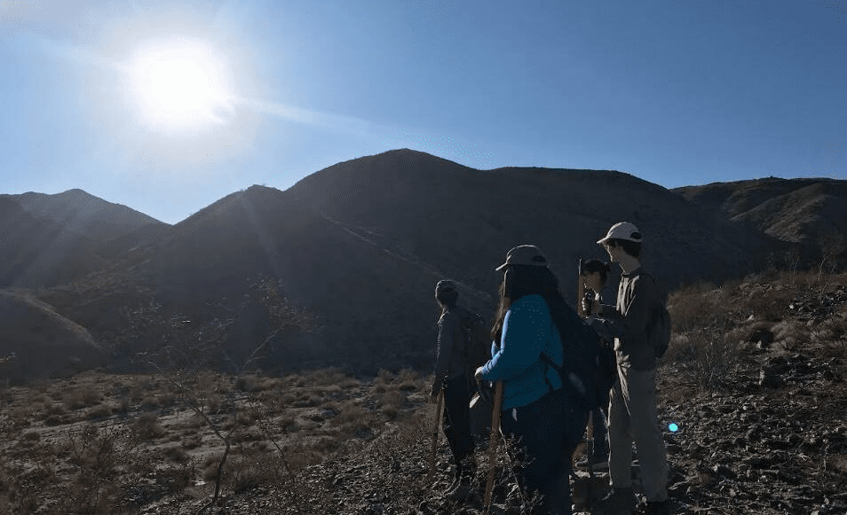 Group hiking in rocky terrain