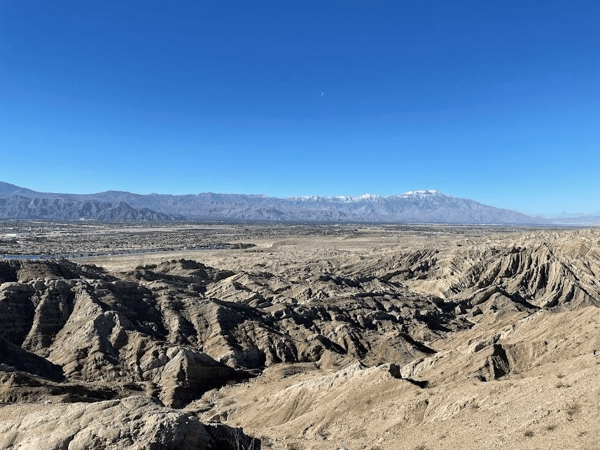 Expansive desert view with rugged hills